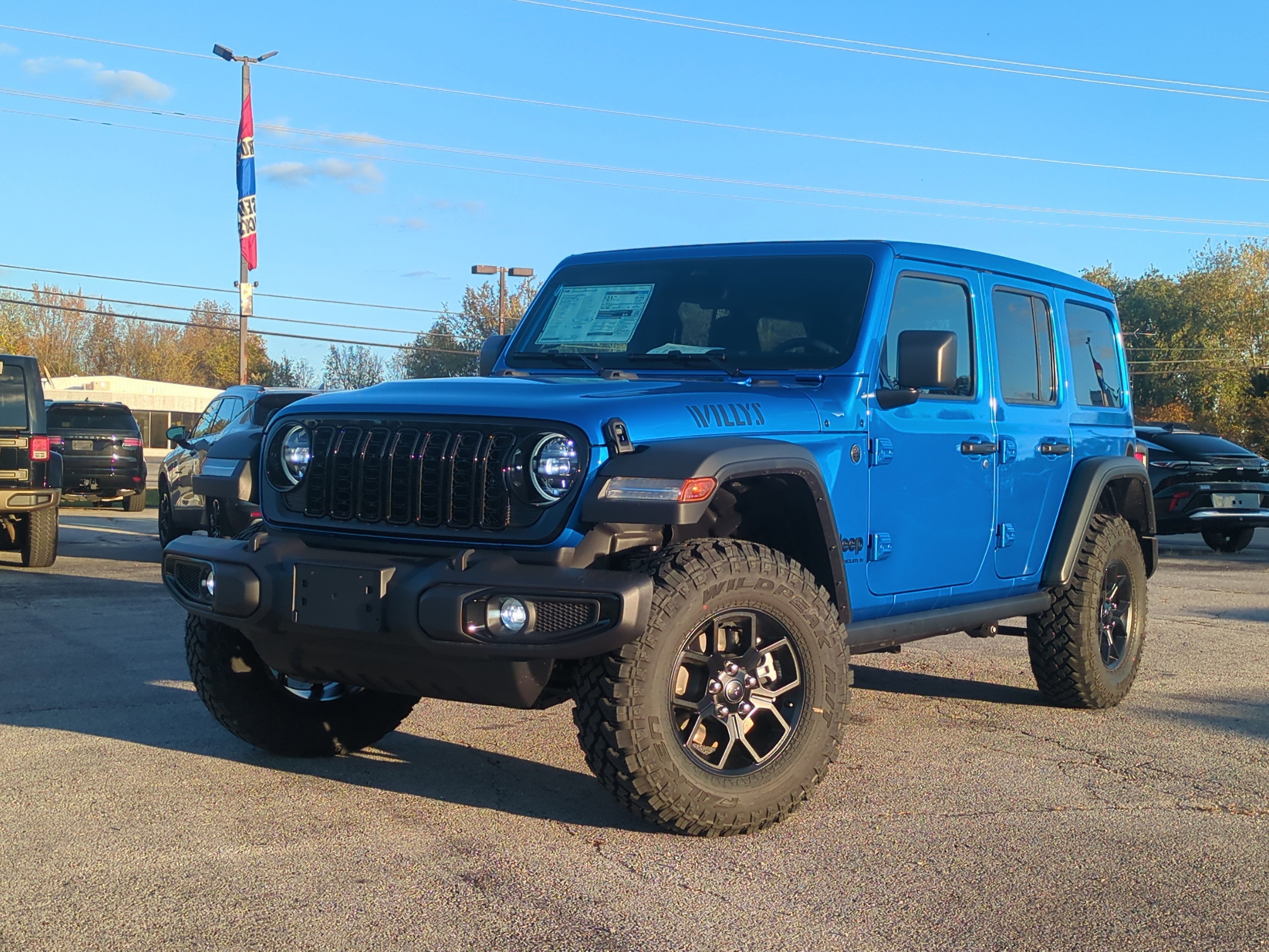 2026 Jeep Wrangler WRANGLER 4-DOOR WILLYS in Hydro Blue Pearl-Coat Exterior Paint — front three-quarter view