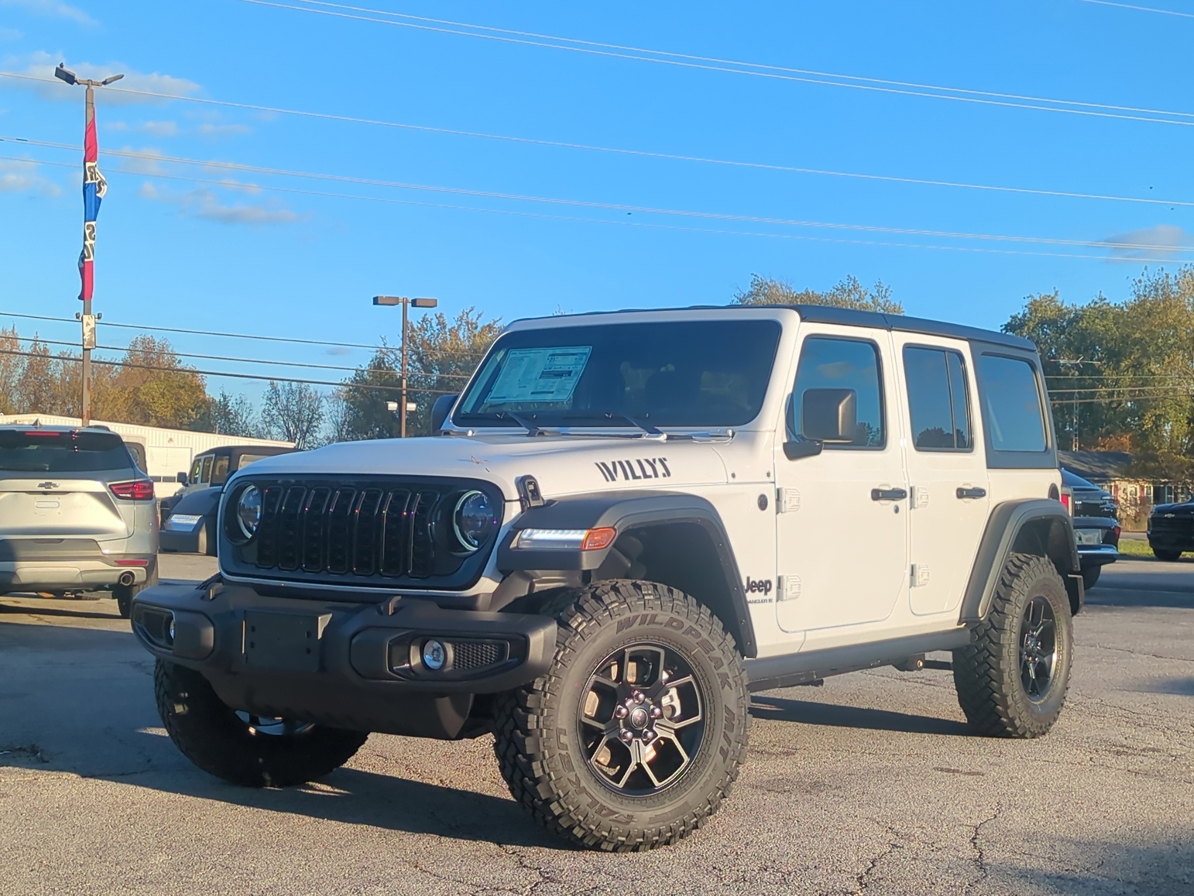 2026 Jeep Wrangler WRANGLER 4-DOOR WILLYS in Bright White Clear-Coat Exterior Paint — front three-quarter view