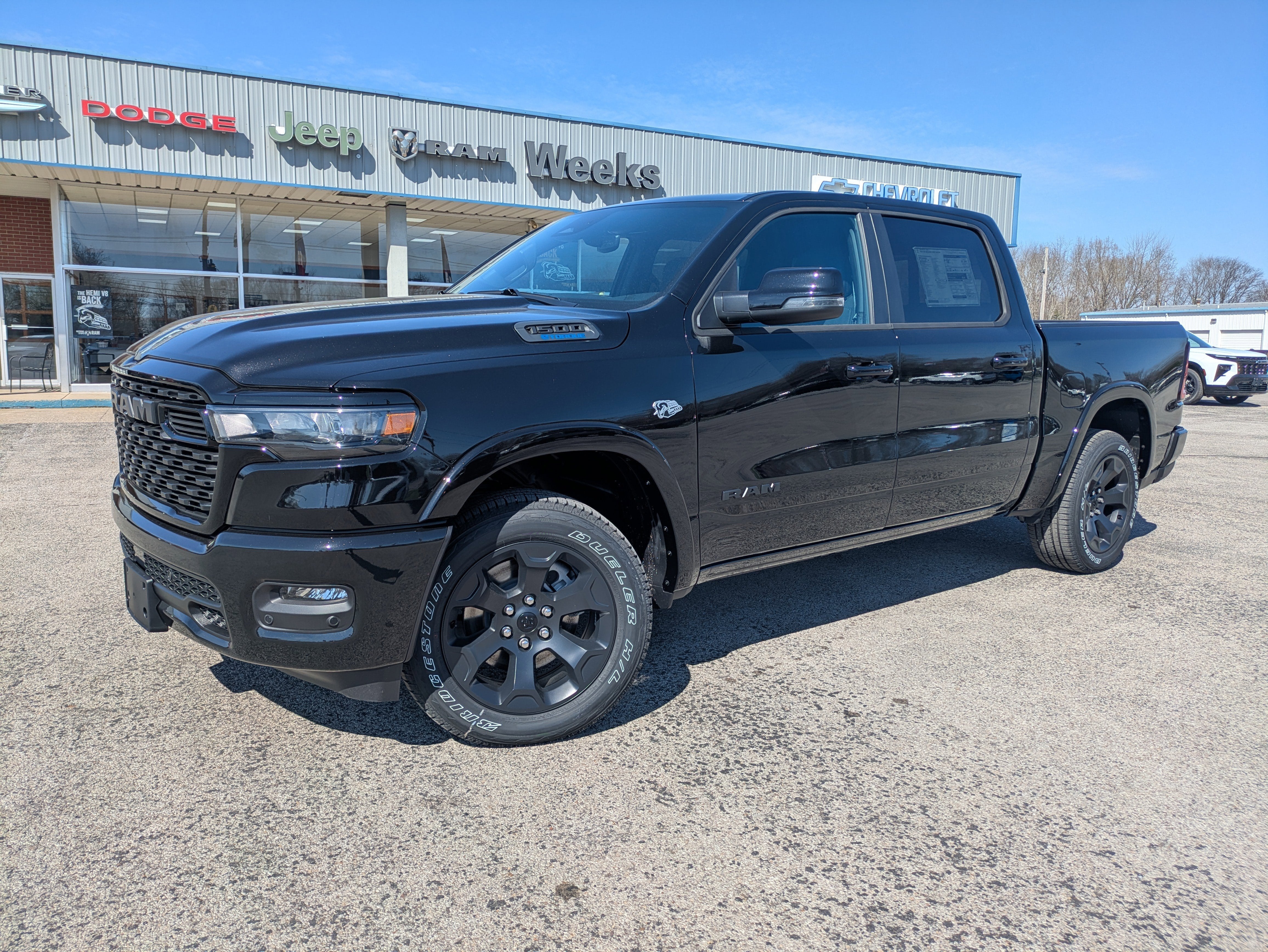 2026 RAM Ram 1500 RAM 1500 BIG HORN CREW CAB 4X4 5'7' BOX in Diamond Black Crystal Pearl-Coat Exterior Paint — front three-quarter view