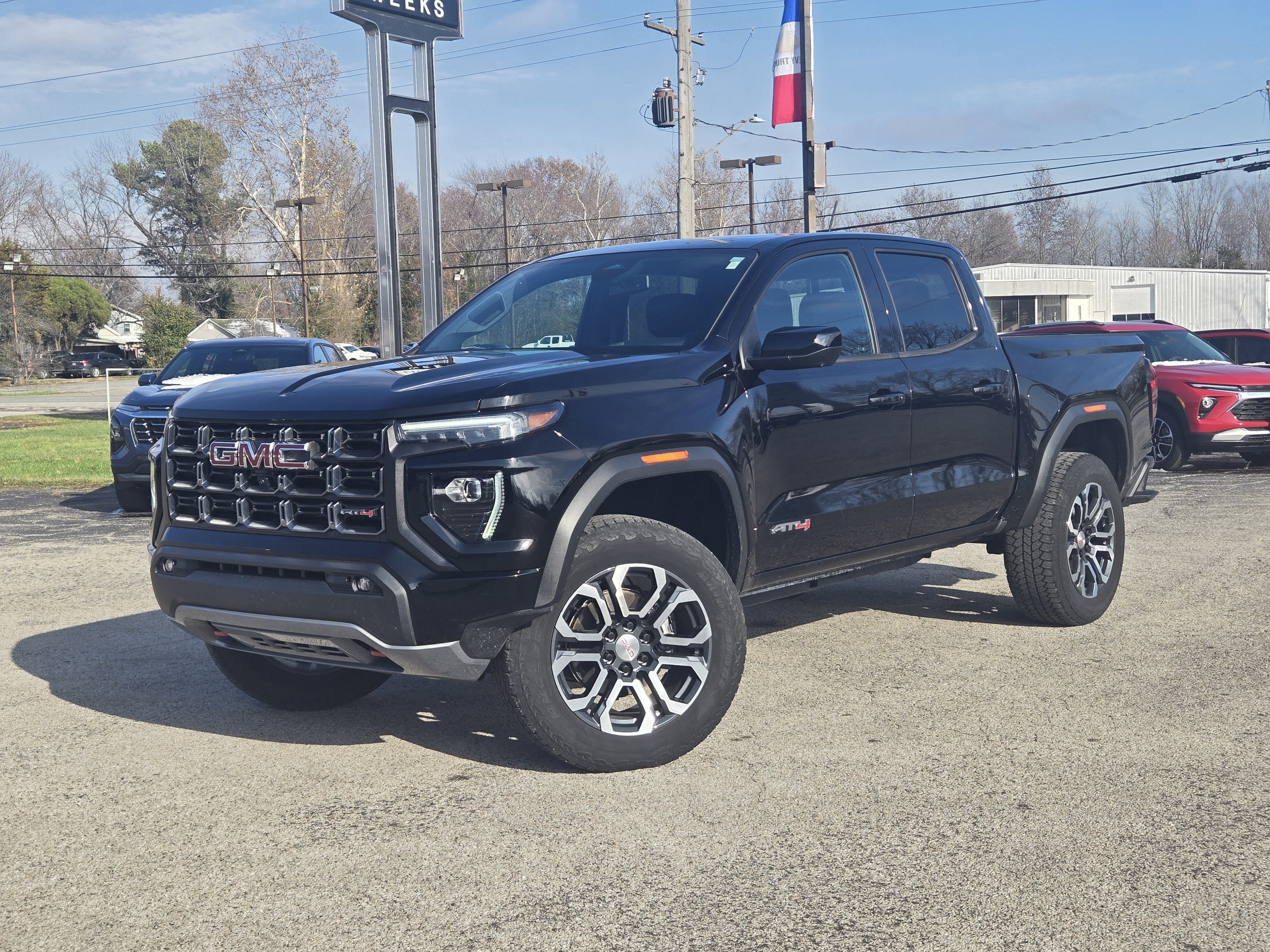 2023 GMC Canyon 4WD Crew Cab Short Box AT4 in Onyx Black — front three-quarter view